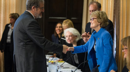 Shlissel and Coleman shake hands