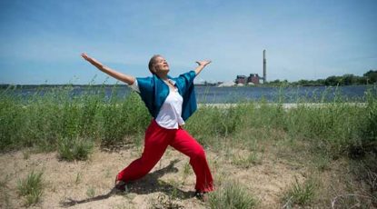 Robin Wilson dances at Lake Michigan.