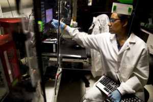 Stacy Ramcharan uses a computerized system to layer polymer fibers, forming a scaffold for growing cells into artificial tissues.