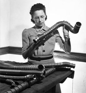 MacGill examines tubing.