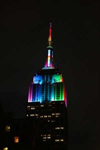 The Empire State Building lit up like a rainbow.