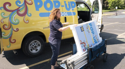 UM-Flint Pop-Up School manager Cathy Lesinski preparing for the day’s activities.