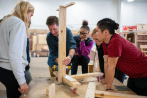 Nick Tobier works with students on hands-on projects at Brightmoor.