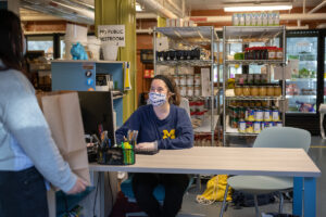 Student staff greets guest