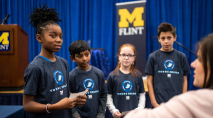 Students from Mason Elementary School of Grand Blanc Community Schools discuss their presentation strategy.