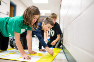 Students from Mason Elementary School of Grand Blanc Community Schools work on their Young Sharks presentation.