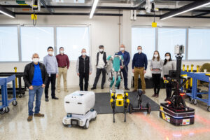 UM FMC Robotics Team with their robots. (Image Credit: Ford Motor Company.)