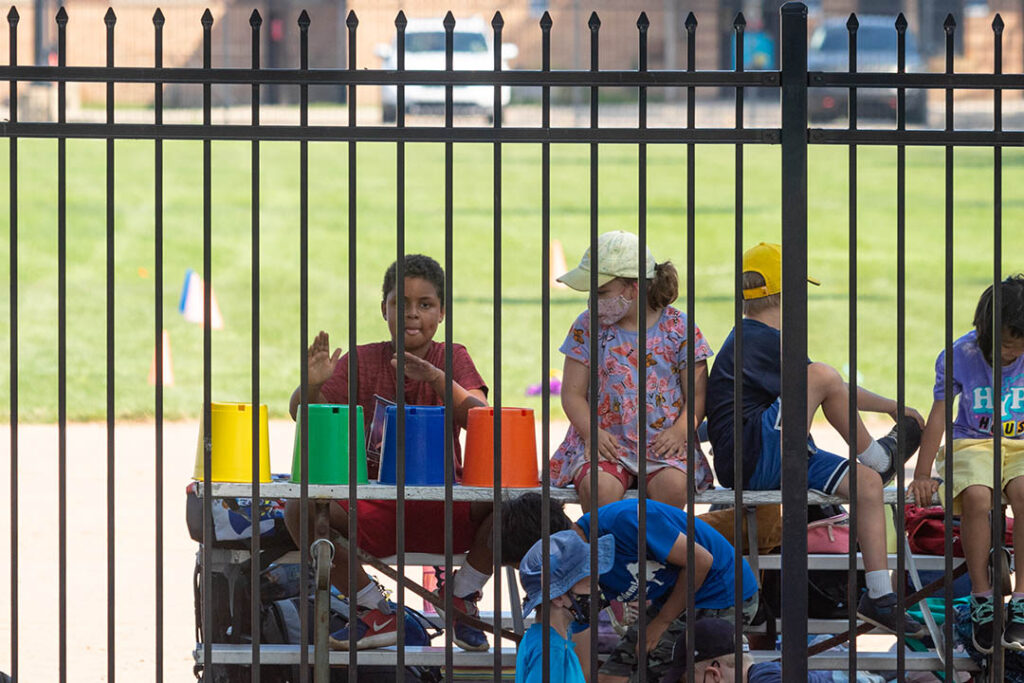 Kids watch the MMB practice at Elbel Field