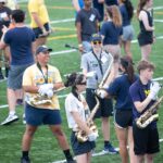 Happy band members practice on the field 2021