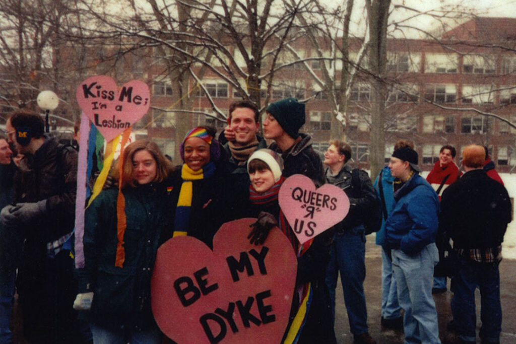 Students with signs about being gay