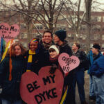 Students with signs about being gay