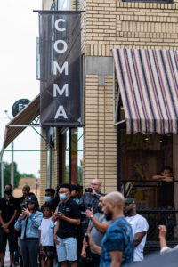 Crowd gather at Comma bookstore