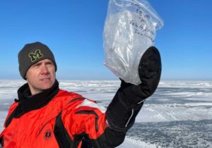 Scientist examines ice