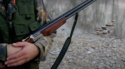 Gun owner cradles rifle