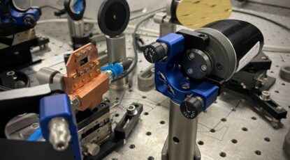 The semiconductor nanosheets in the water-cooled copper mount turn an infrared laser pulse into an effectively unipolar terahertz pulse. The team says that their terahertz emitter could be made to fit inside a matchbox. Image credit: Christian Meineke, Huber Lab, University of Regensburg