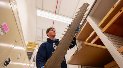 Charlie Engelman and a big long saw-looking bone.
