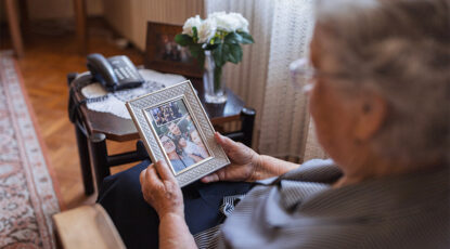 Elderly woman with photos