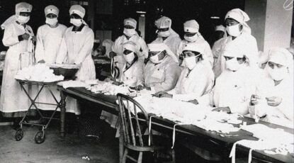 Black & white image of Red Cross volunteers in masks