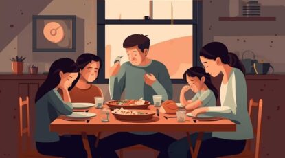 Family seated at a dinner table.