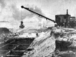 Construction equipment at big hole where Big House now stand. Image is circa 1926.