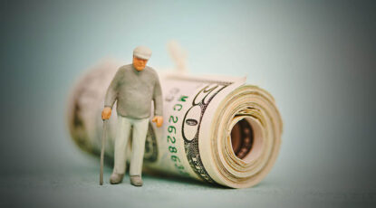 Graphic that shows elderly man with a cap and cane standing in front of a wad of money.