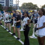 Line of Michigan Marching Band horn players