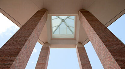 View of the Duderstadt pillars at the entrance of the building, taken from below looking up.