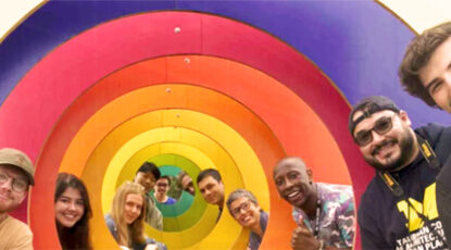 Students inside a coloful tunnel