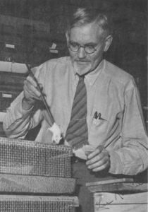 Black & white image of University of Michigan's Dr. Lee Raymond Dice with one of his experimental white mice.