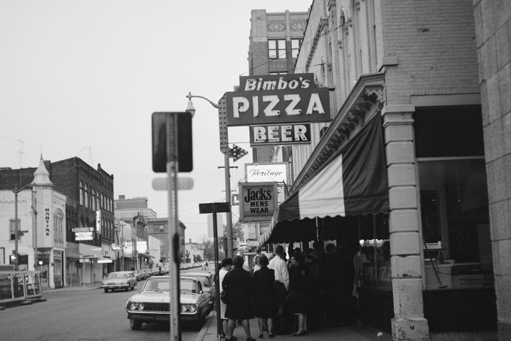 Exterior of Bimbo's Pizza neon sign in Ann Arbor, Michigan.