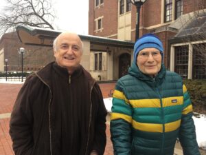 Two chemistry scholars in winter clothes on the University of Michigan campus.