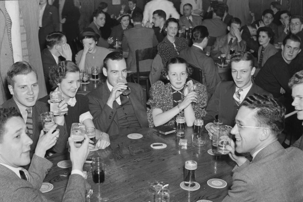 Group of caucasian students gather at the Pretzel Bell for drinks in 1937.