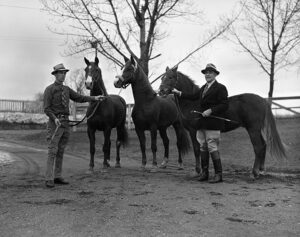 Black and white image of U-M president Alexander Ruthven with one of his prized horses.