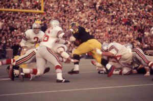 Color photograph of U-M's No. 42, Billy Taylor, against Ohio State in 1969.