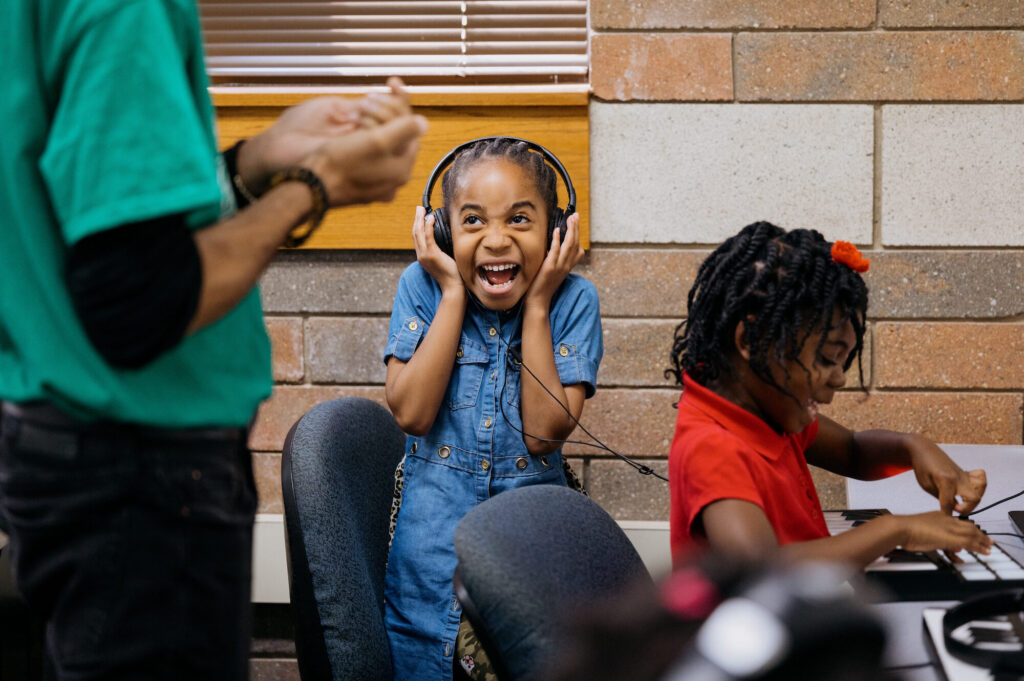 A student reacts while listening to their creation during music production class at Crescendo Detroit, an after-school program for children ages 5 to 18 that develops music and dance programming to promote artistic excellence and character building.