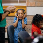 A student reacts while listening to their creation during music production class at Crescendo Detroit, an after-school program for children ages 5 to 18 that develops music and dance programming to promote artistic excellence and character building.