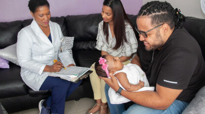 A family is interviewed by a member of the Maternal and Infant Health Program research team. (Photo courtesy of Maternal and Infant Health Program)