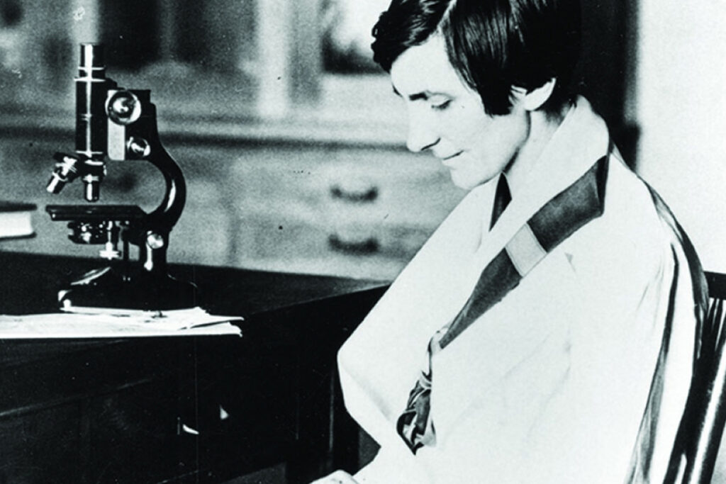 Black and white image of a female scientist at the University of Michigan