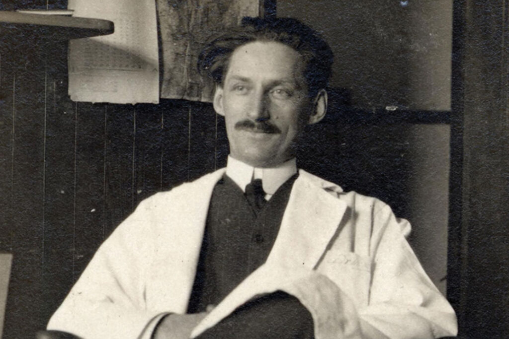 Caucasian scientist and early X-ray pioneer sits in a University of Michigan laboratory,