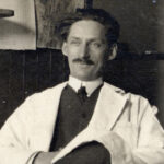 Caucasian scientist and early X-ray pioneer sits in a University of Michigan laboratory,