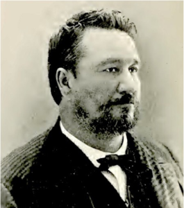 Beared man, headshot in profile.