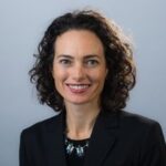 Headshot of U-M AVP of public affairs Colleen Mastony, caucasian woman with shoulder-length, dark hair