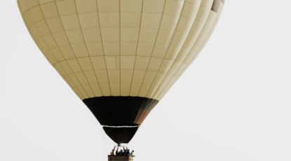 Hot air balloon sails through the sky.