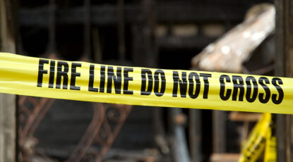 Yellow tape reads: Fire Line Do Not Cross