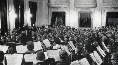 Black and white photo of WIlliam Revelli conducting Michigan Symphony Band in the Leningrad Conservatory, 1961.