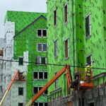 Workers at the Central Campus residential housing project, 2025.