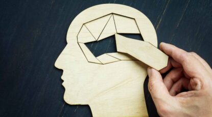 Graphic of human brain as though it were a puzzle with a key piece missing.