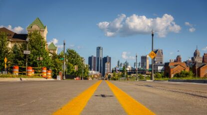 Downtown Detroit from a street-level view toward the General Motors Renaissance Center. (Photo Alexy Stiop, Adobe Stock)