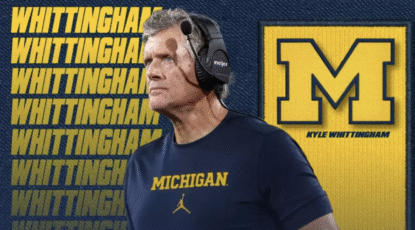 Caucasian man with silver hair stands in front of Block M background that reads Whittingham.
