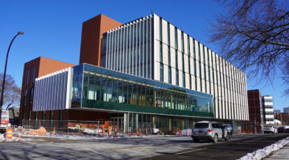 College of Pharmacy at University of Michigan, a modern building with lots of glass and terra cotta brick.